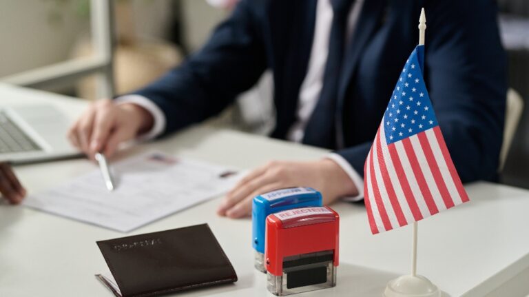 approved and rejected stamps on table in US immigration office